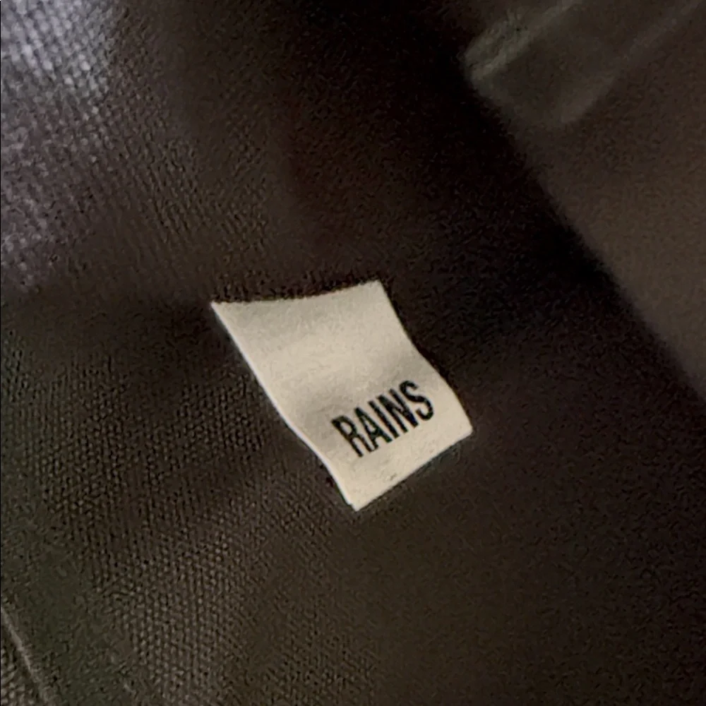 Rains Black Backpack. Clean and ever contemporary.